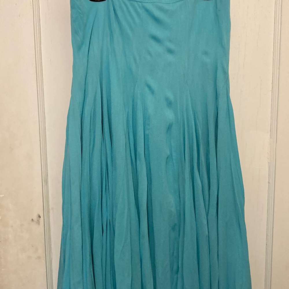 This flowing skirt is perfect for spring and summer.  Shear fabric with lining.